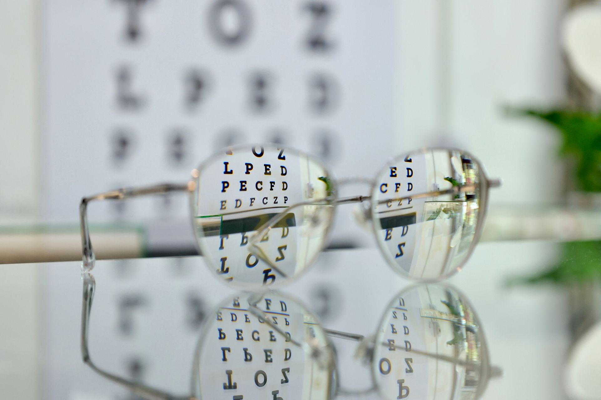 Eyeglasses on the glass cabinet inside the optical shop