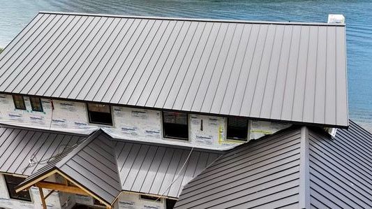 A close up of a roof with a lot of shingles on it.