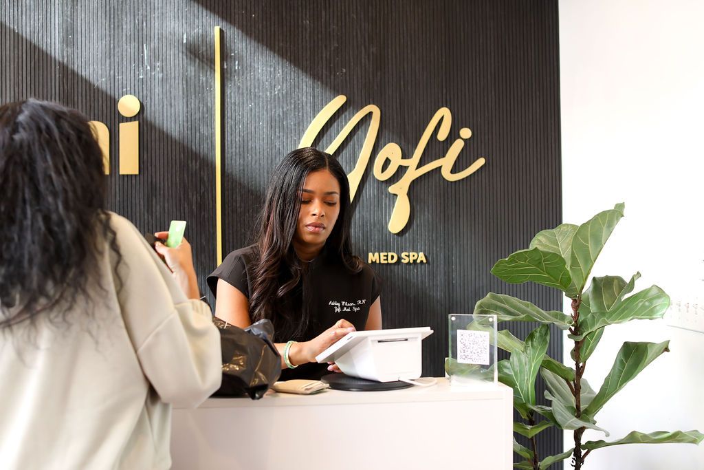 A woman is taking a picture of another woman at a spa.