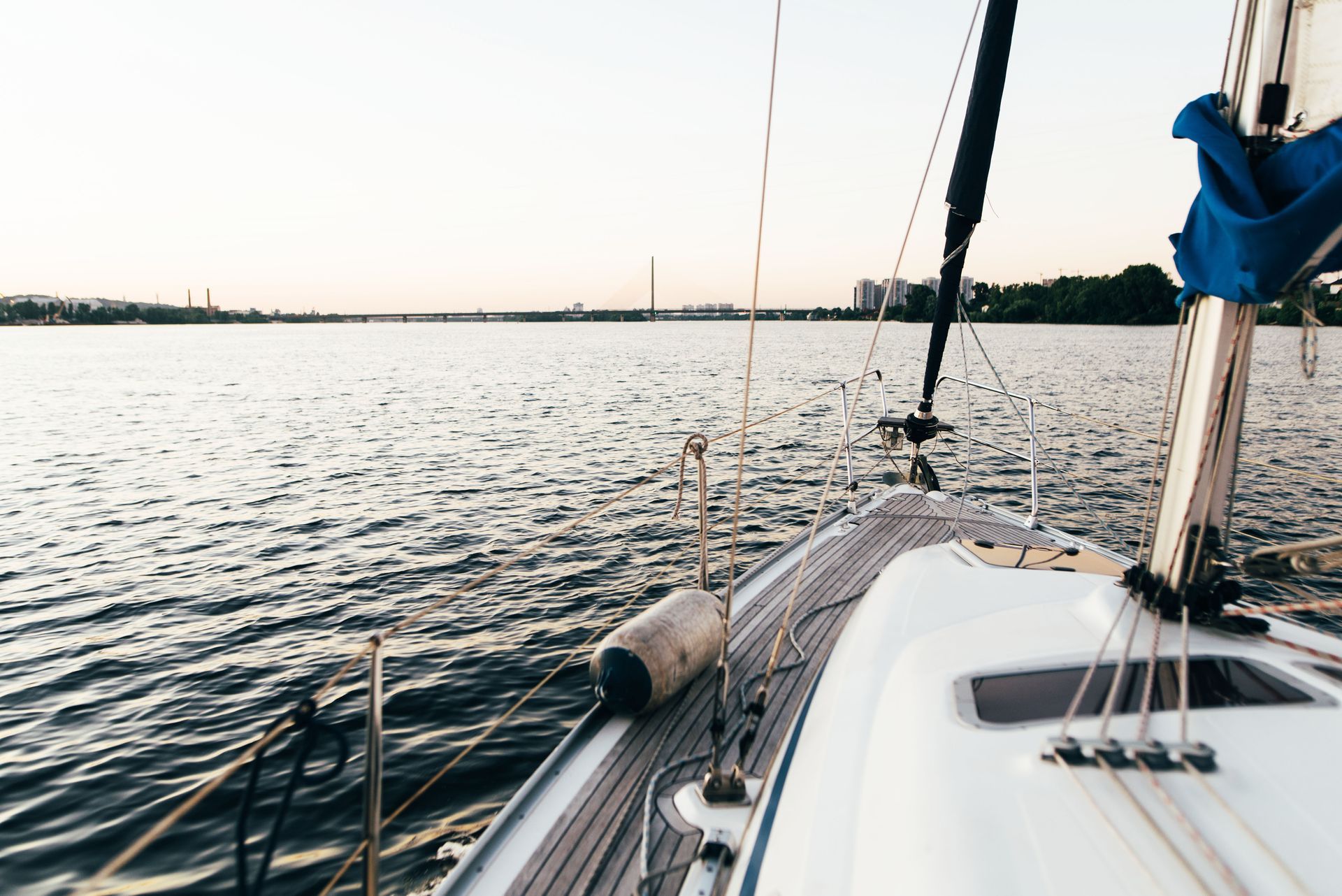 A sailboat is floating on top of a body of water