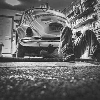 Mechanic Under a Beetle | A2B Euro Car Repair