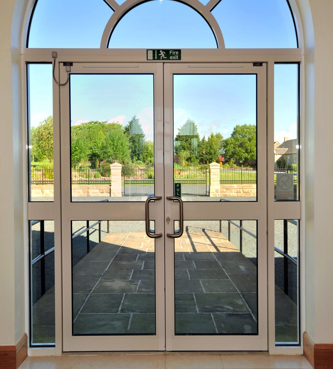 A view out of the doors onto green gardens at Oakwood Park Business Centre