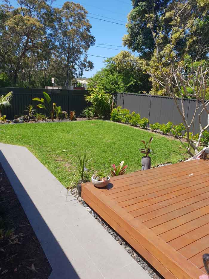 Backyard with a Deck and Gardens — Landscaping inspiration in Matcham, Central Coast