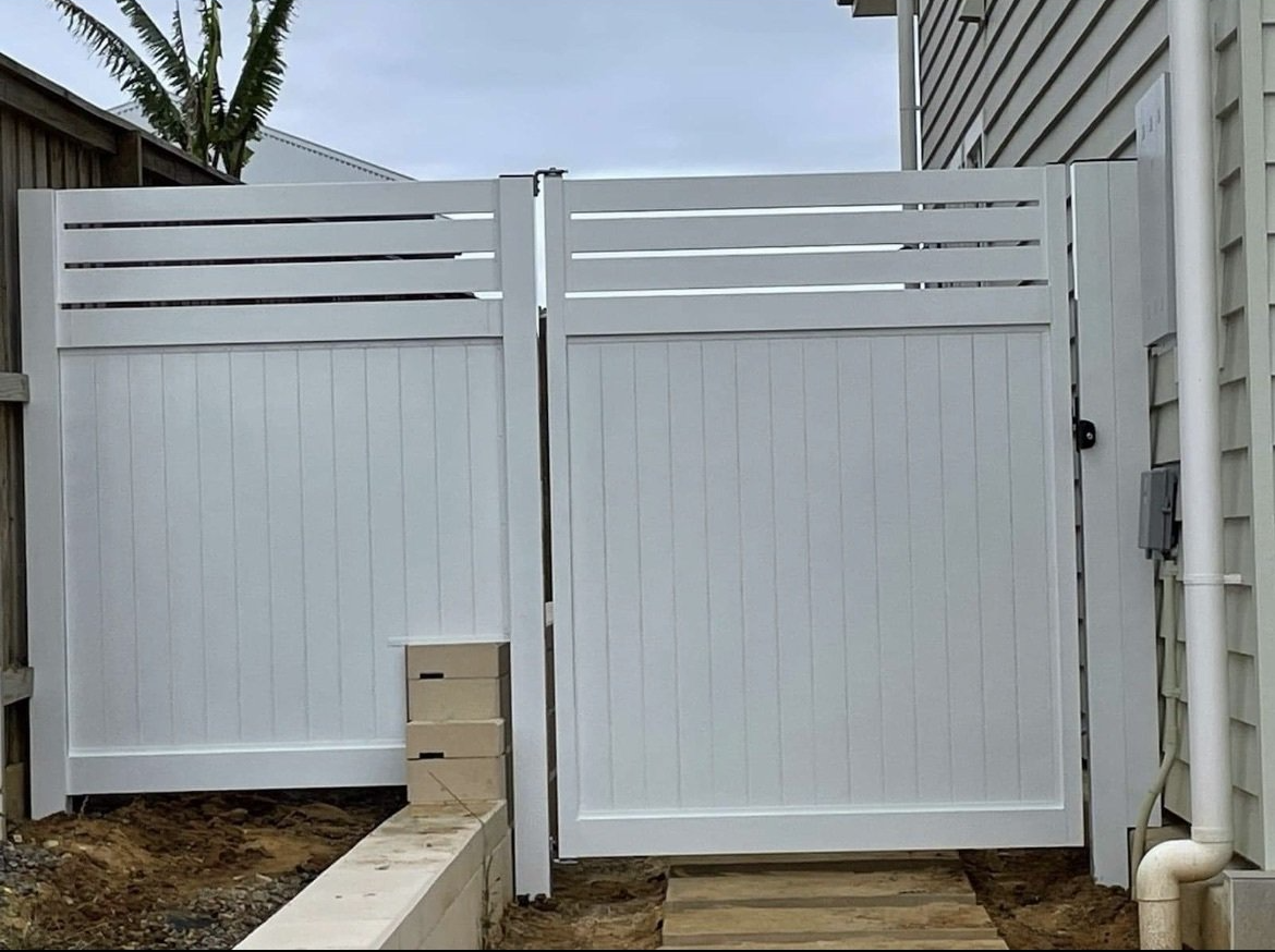 White vinyl fence and double gate.
