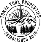 Circular black-and-white Tonya York Properties logo with mountain, windmill, trees, and “Established 2018” text