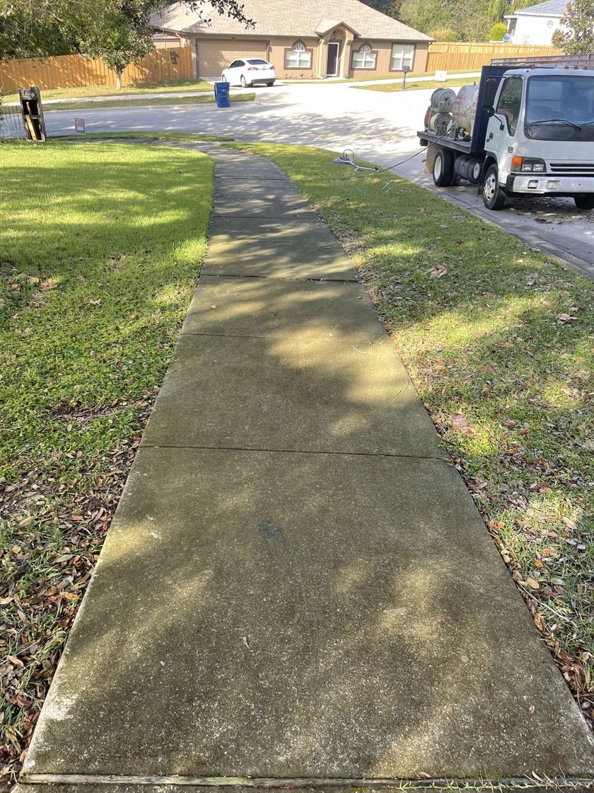 Expert pressure washing for driveway and sidewalk rejuvenation