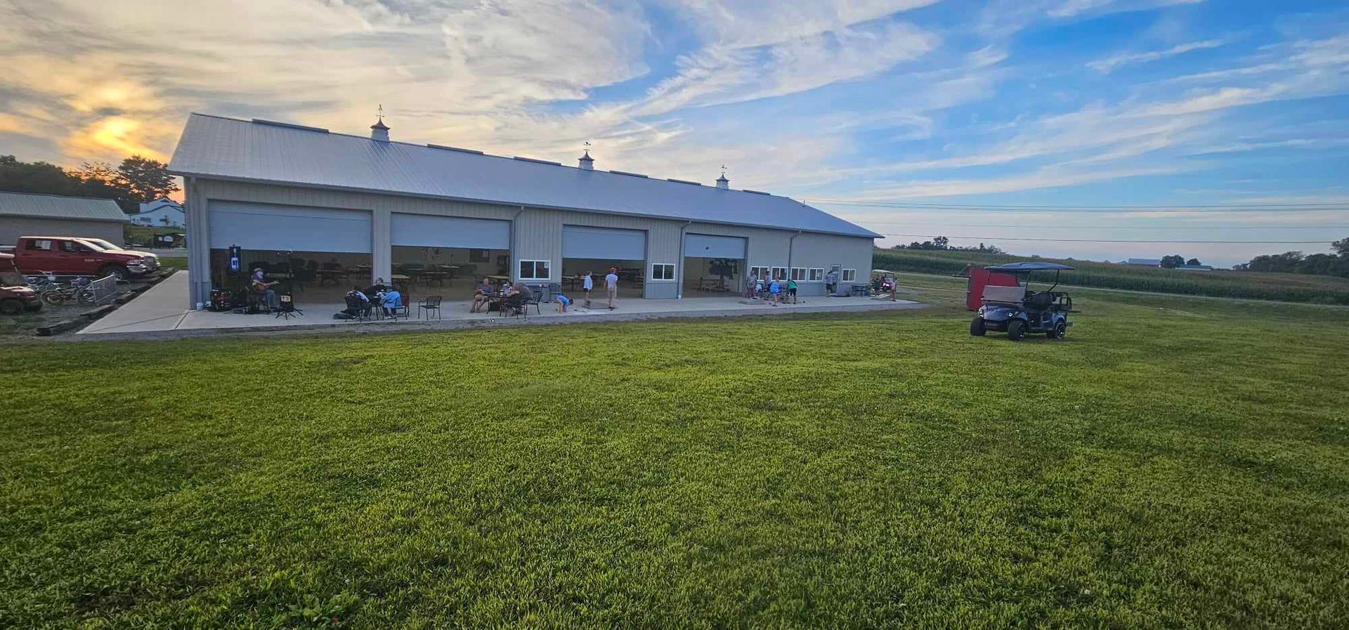 a group of people sit on a patio outside of a building