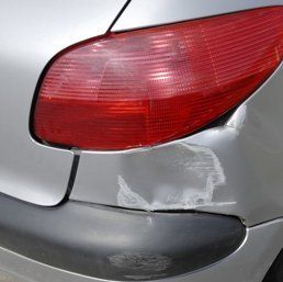 Slightly dented vehicle rear