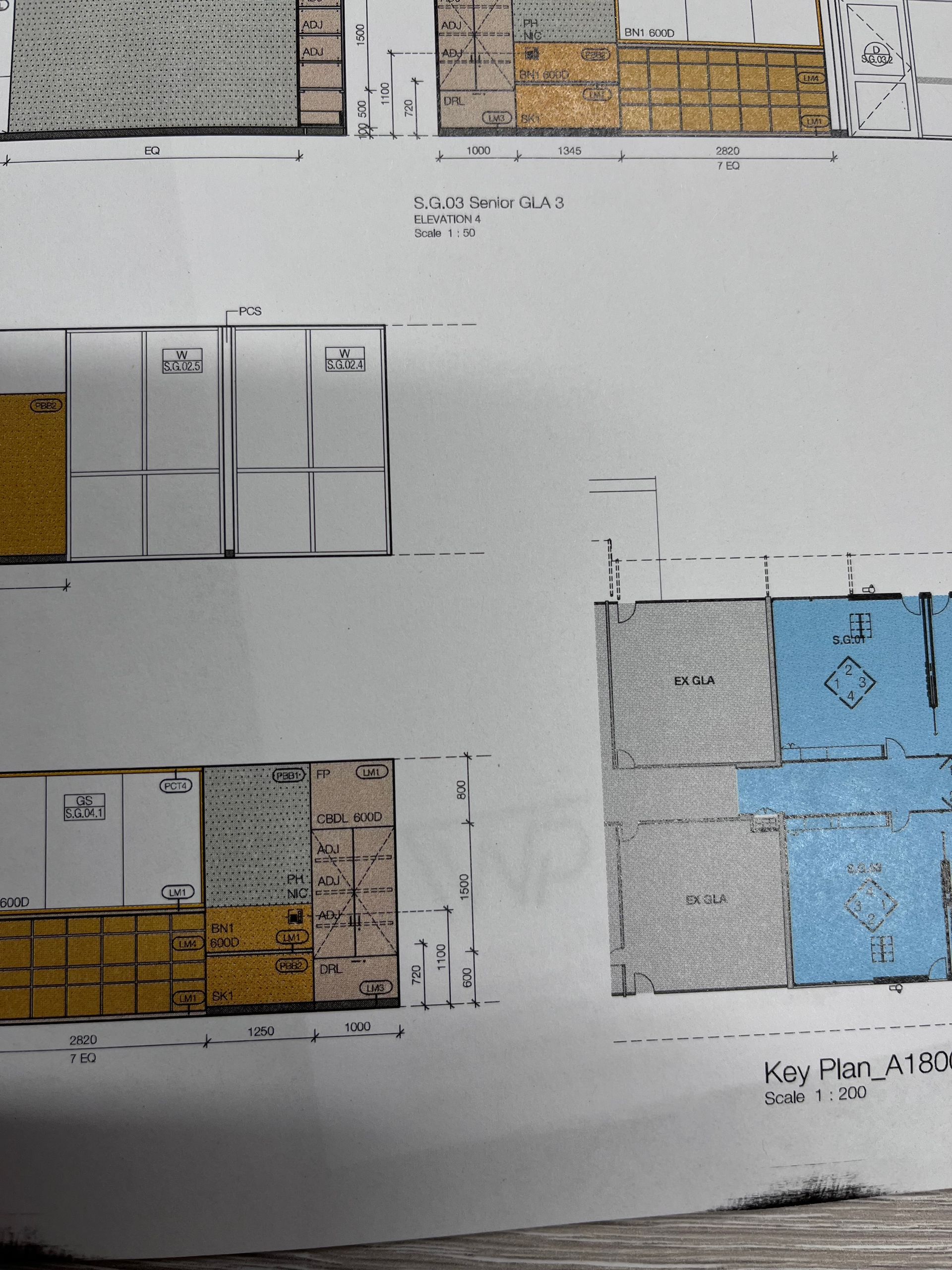 Floor plan with various rooms in different colors: yellow, blue, gray, and brown.