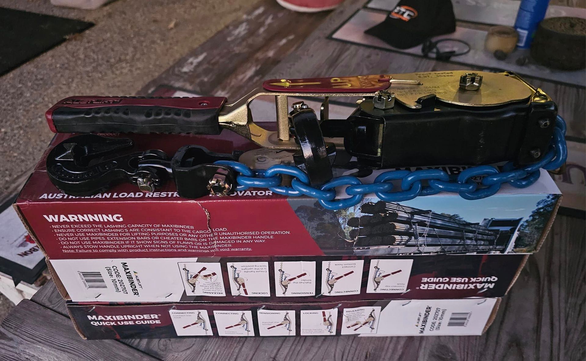 A box with a chain on it that says warning on it