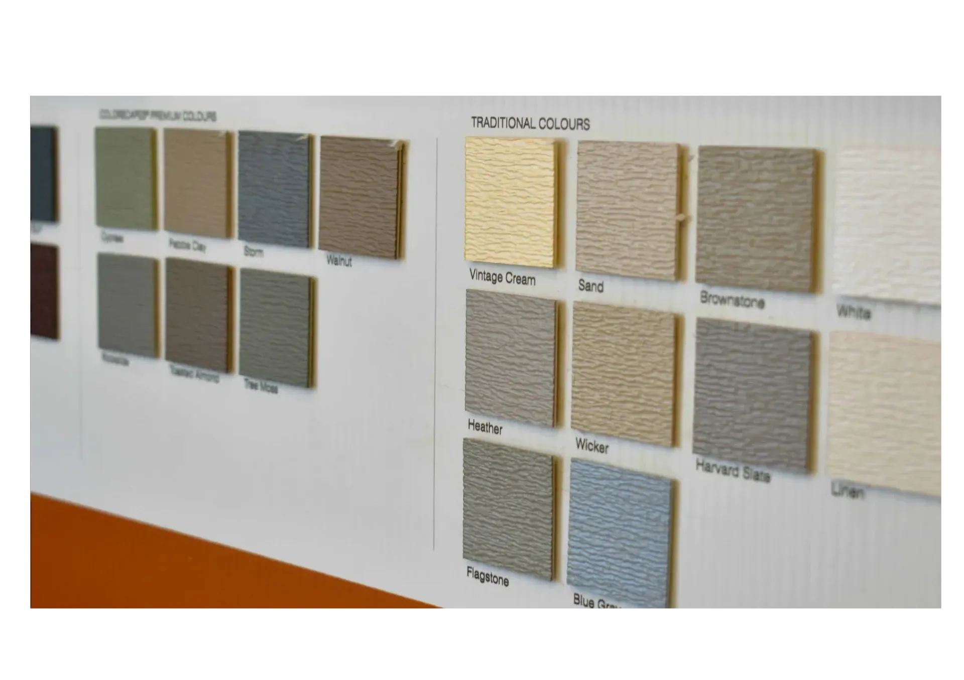 Color swatches in various shades of beige, gray, and blue arranged on a white display board.