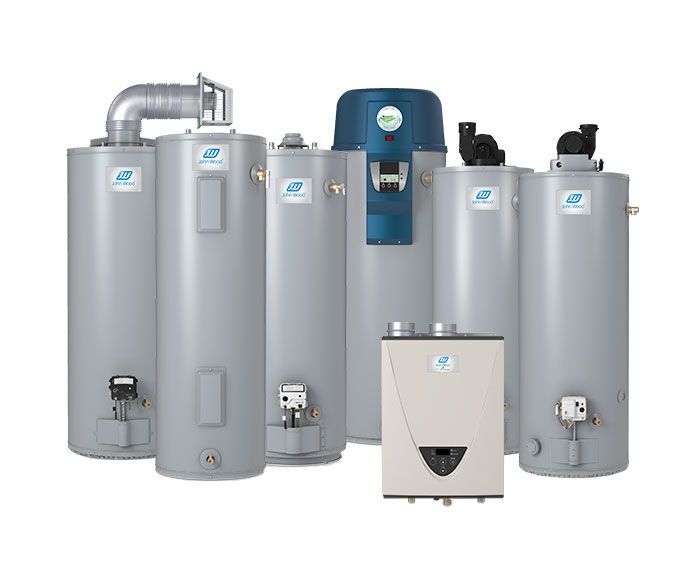 A group of water heaters sitting next to each other on a white background.