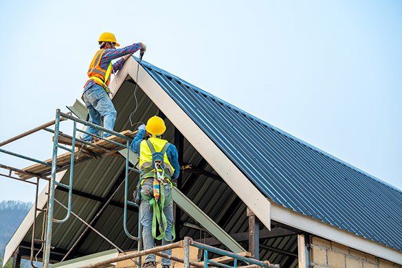 Men Drilling On Metal Roof — Beaver Damn, WI — Heimerl Corporation