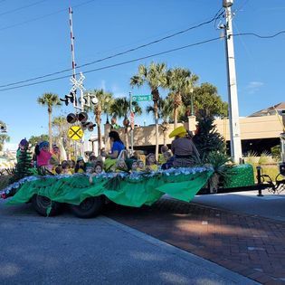 A group of people are riding on a float in a parade.