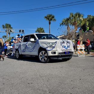 A white truck with the word bombers on the side of it