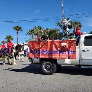 A truck with a sign on the back that says 