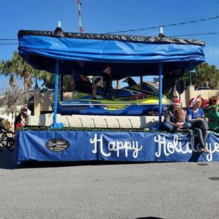 A float that says happy holidays on it