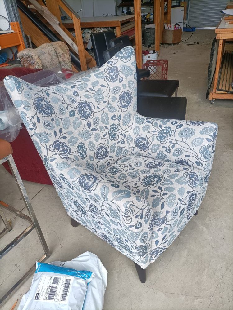 A Chair With A Blue And White Floral Pattern Is Sitting In A Room — Ocean Charm Upholstery In Southport, QLD