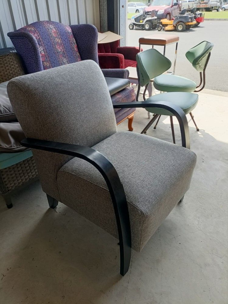 A Chair Is Sitting In A Room With Other Chairs — Ocean Charm Upholstery In Southport, QLD