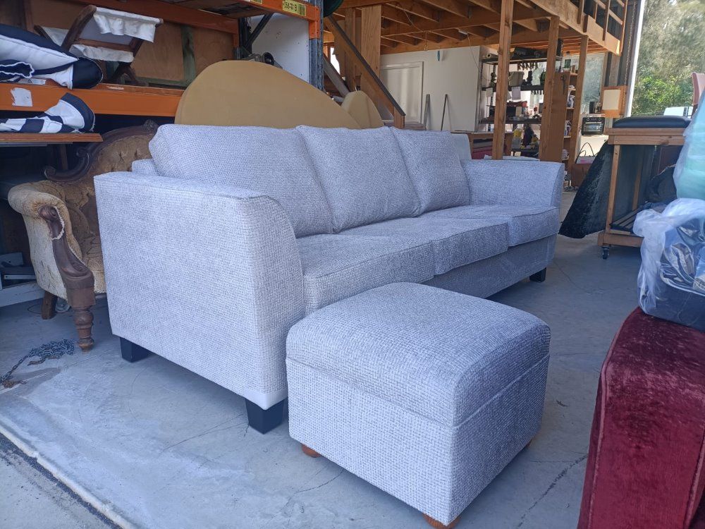 A White Couch And Ottoman Are Sitting In A Garage — Ocean Charm Upholstery In Southport, QLD