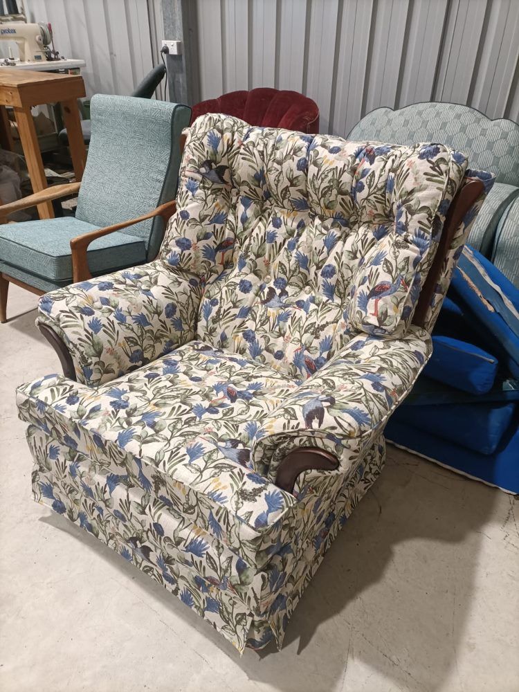 A Chair With A Floral Pattern Is Sitting In A Room With Other Chairs — Ocean Charm Upholstery In Southport, QLD