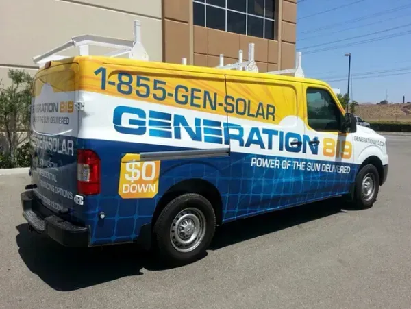 A blue and yellow van that says generation 8 on it
