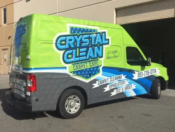 A green and gray van for crystal clean carpet care
