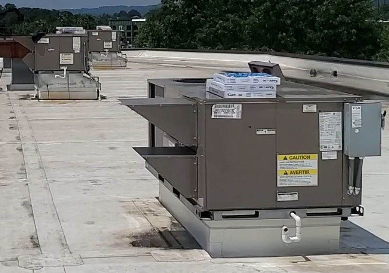 A person is cleaning a bathroom sink with a spoon.