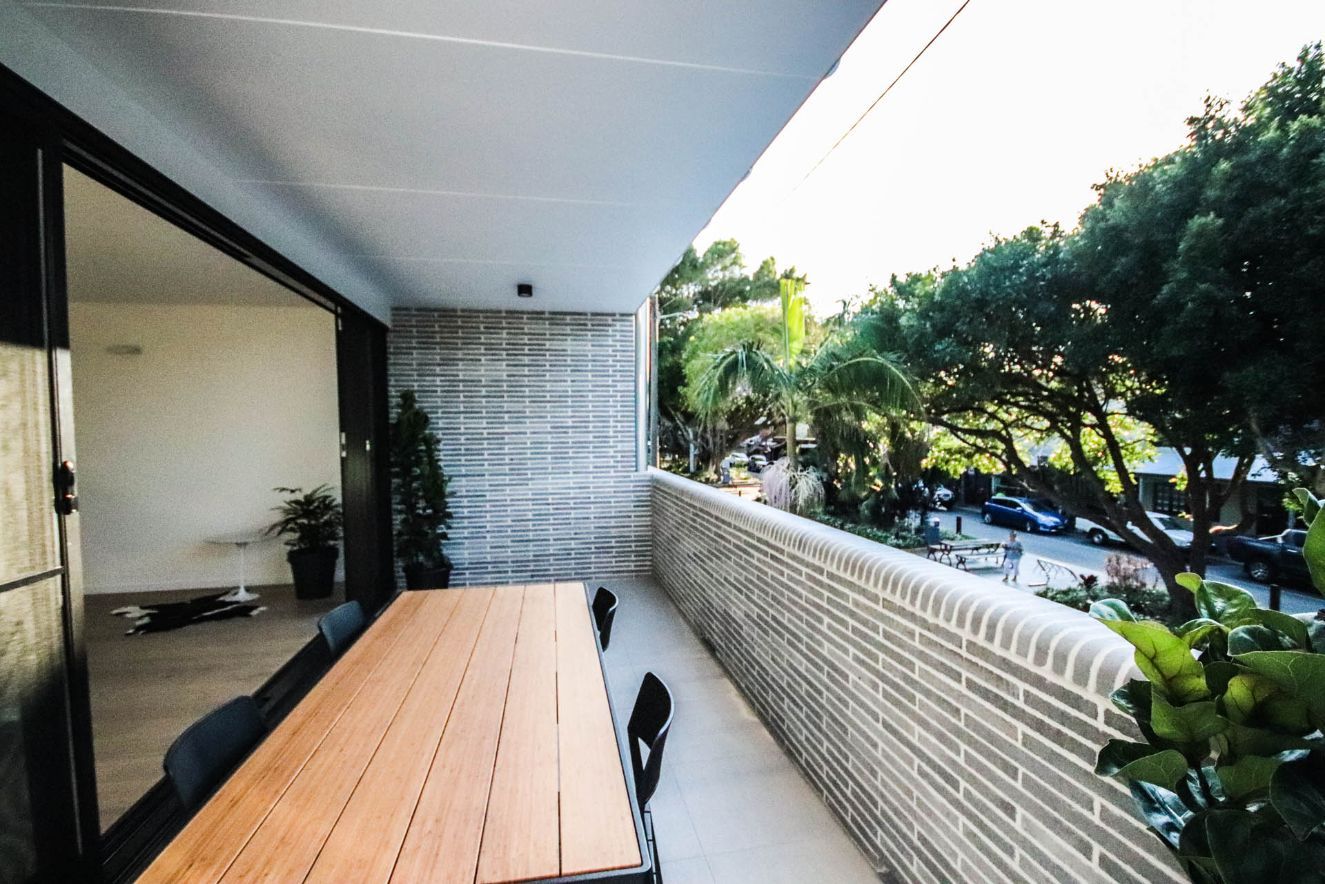 Terrace With Wooden Table — Electricians in Coffs Harbour, NSW