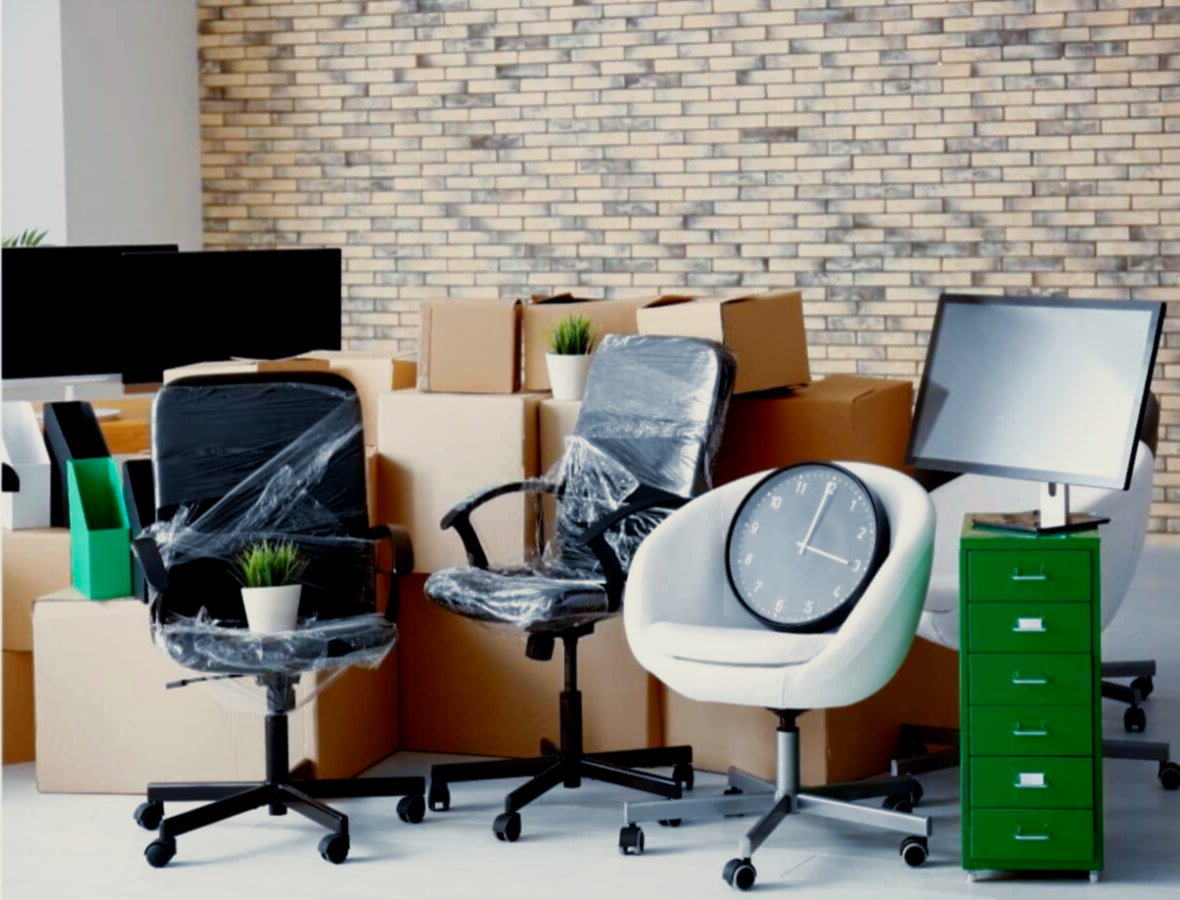Commercial junk removal with office chairs, boxes, and electronics ready for disposal.