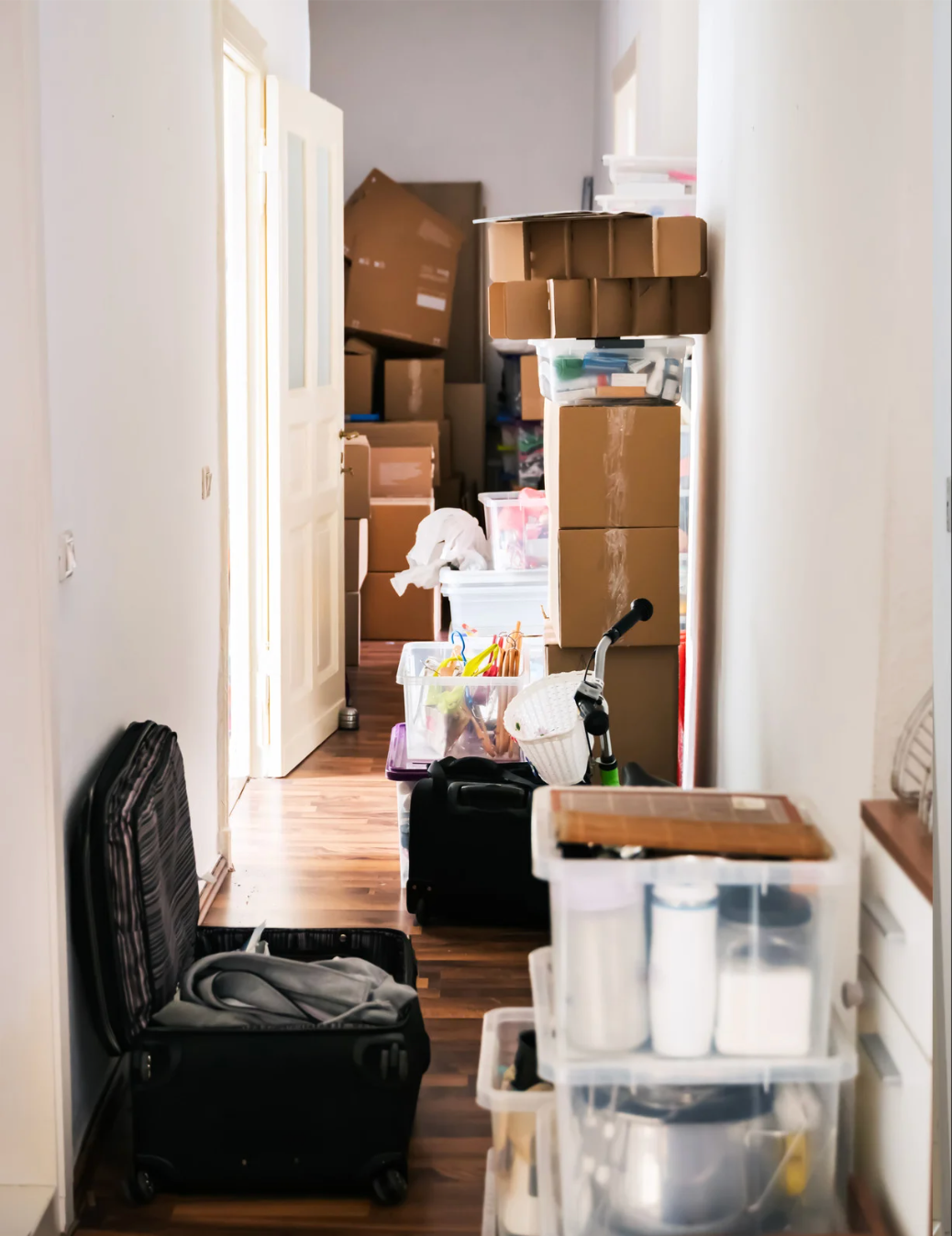 Cluttered home filled with boxes and junk before junk removal service.