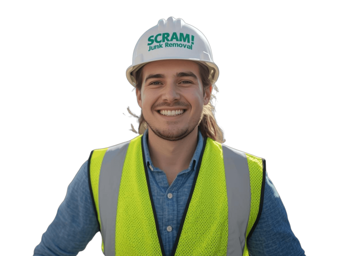 Smiling junk removal worker wearing SCRAM! Junk Removal hard hat and safety vest.