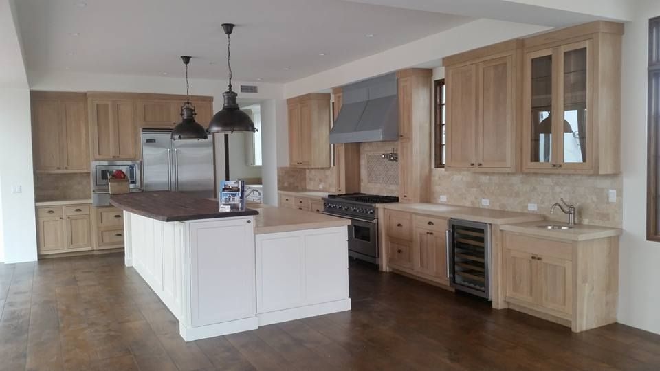 A large kitchen with wooden cabinets and stainless steel appliances.