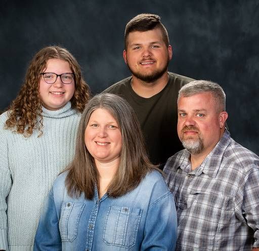 A group of people are posing for a picture together.