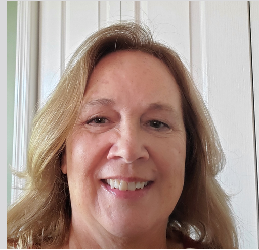 A close up of a woman 's face smiling