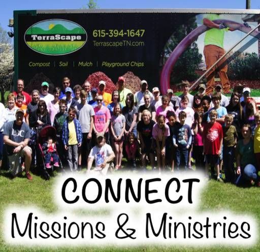 A large group of people standing in front of a sign that says terrascape