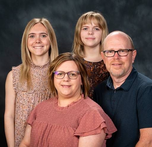 A group of people are posing for a picture together.