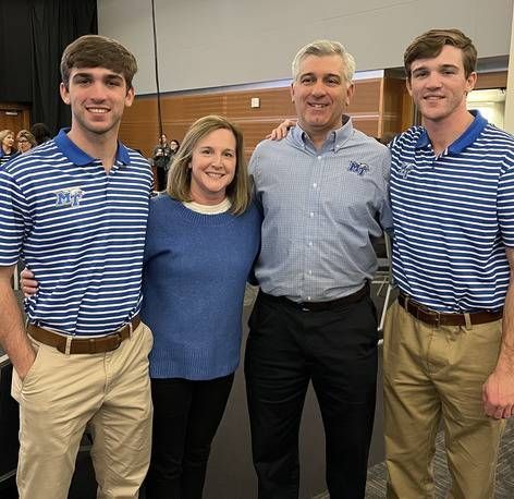 A group of people are posing for a picture together.