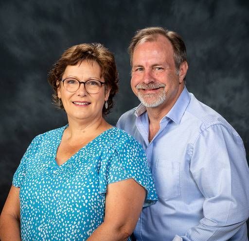 A man and a woman are posing for a picture together.