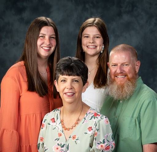 A group of people are posing for a picture together.