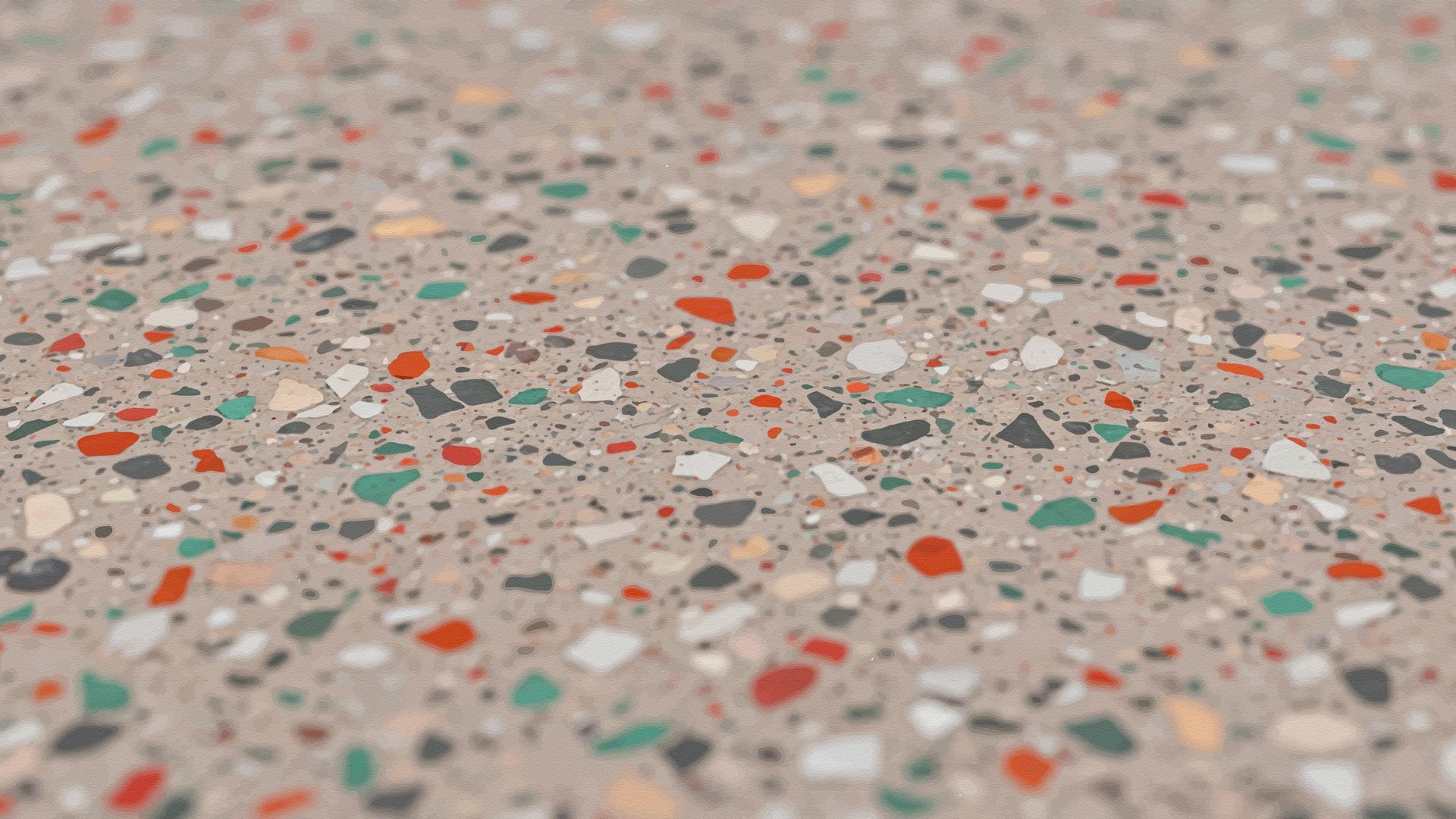 Close-up of a speckled concrete surface with multi-colored aggregate chips.