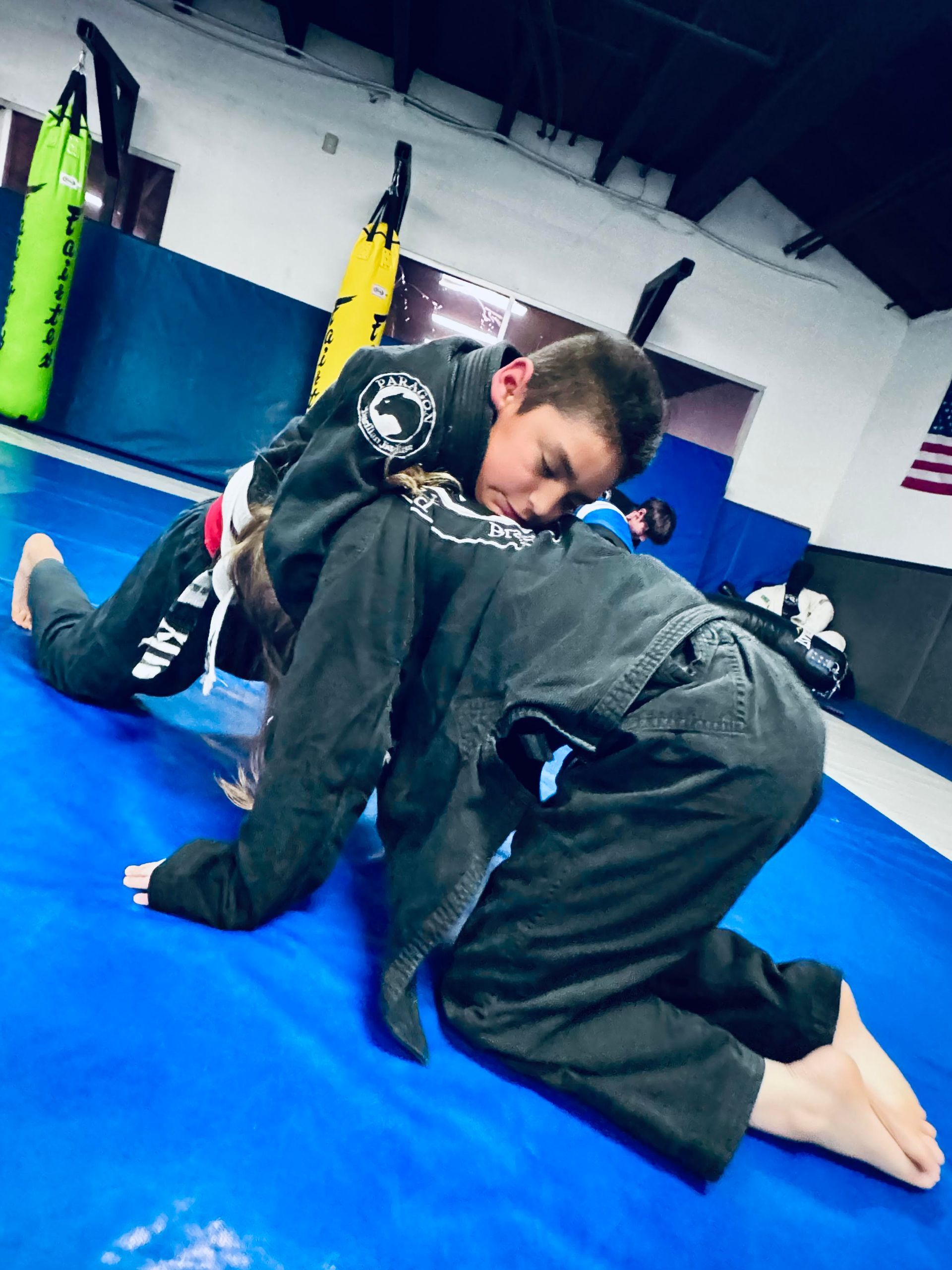 Students practice controlled grappling drills at Paragon Simi Valley in Simi Valley, CA to build self-defense skills.