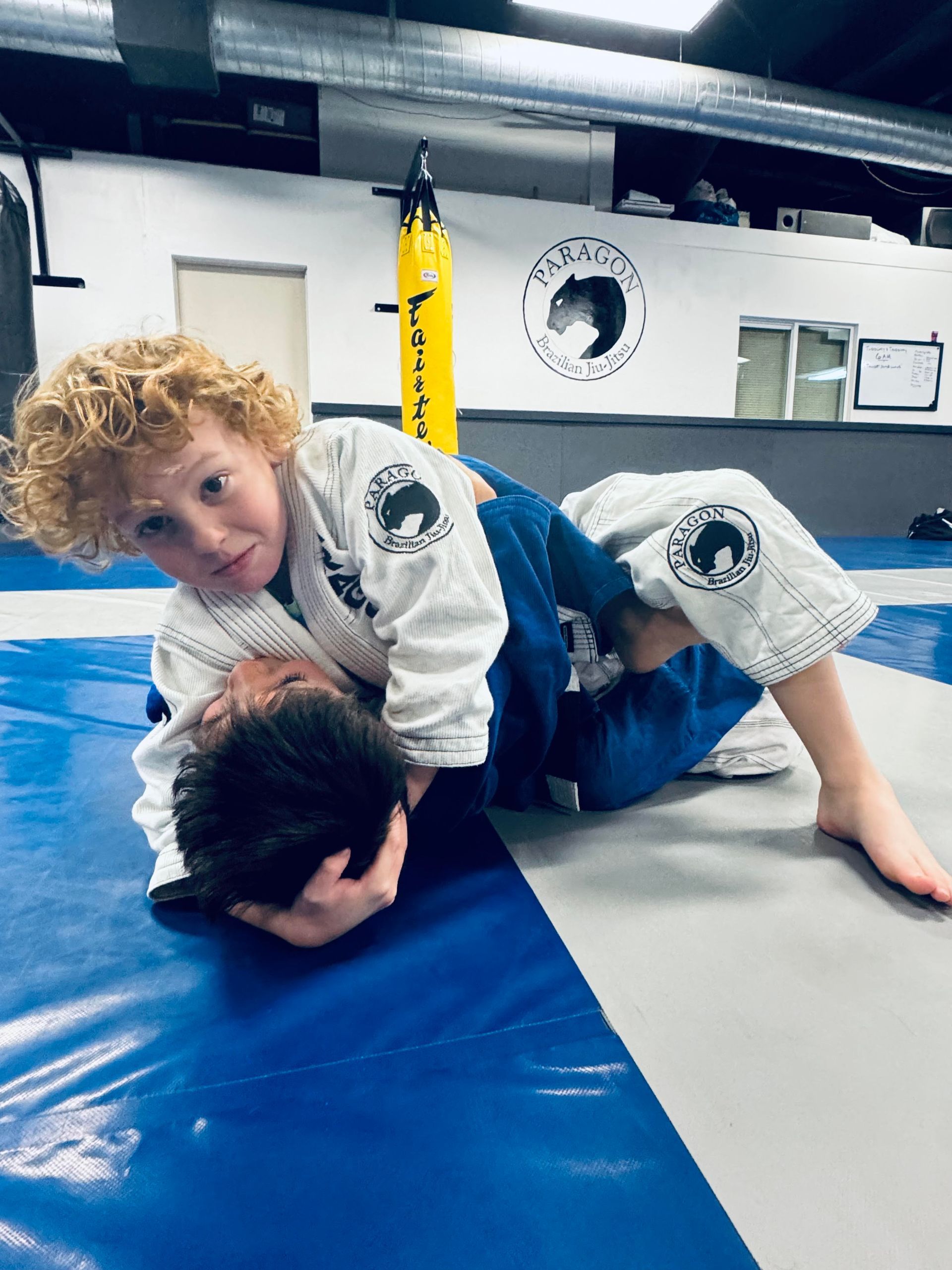 Kids and teens train Brazilian jiu jitsu at Paragon Simi Valley in Simi Valley, CA, building confidence and focus.