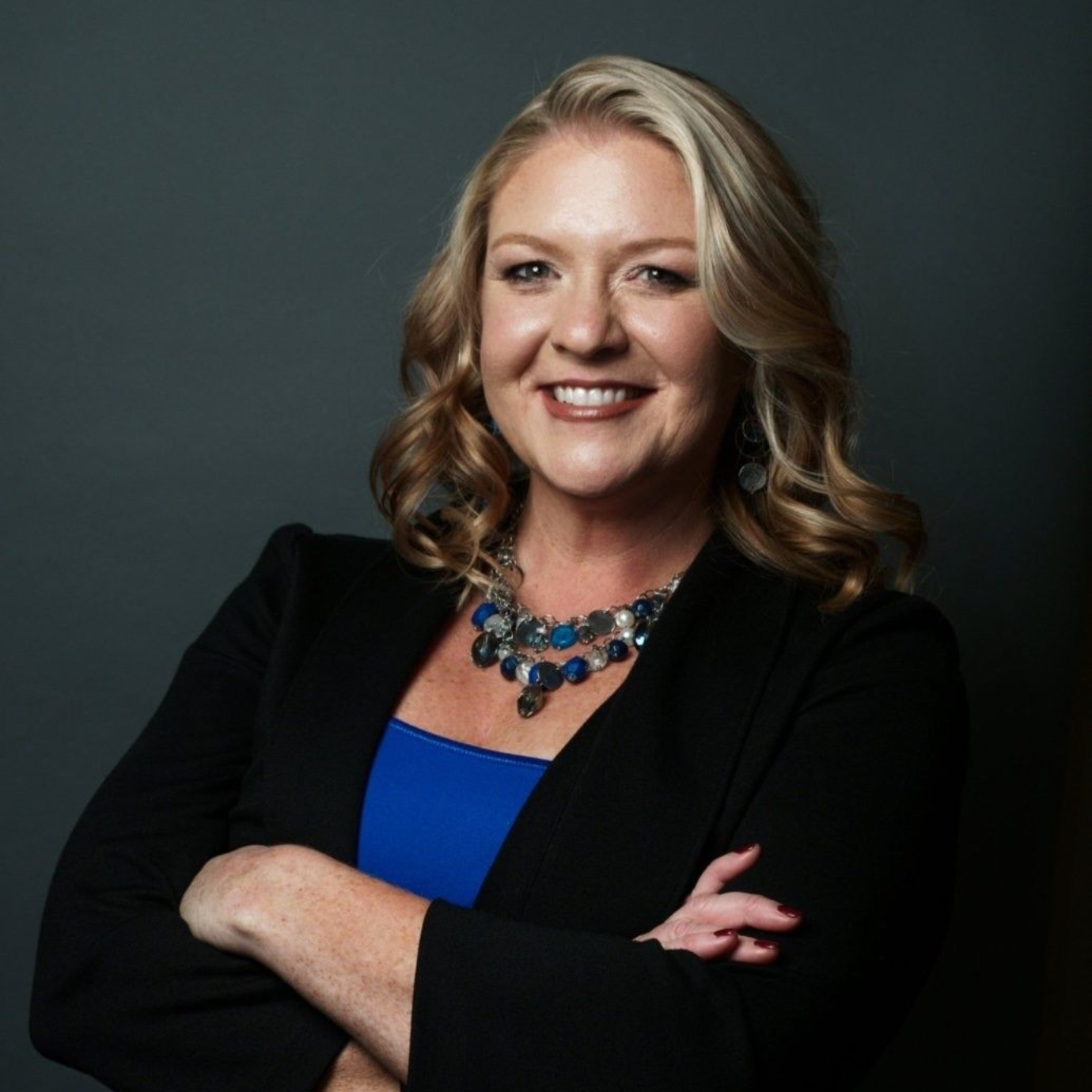 A blue scale of justice on a white background.