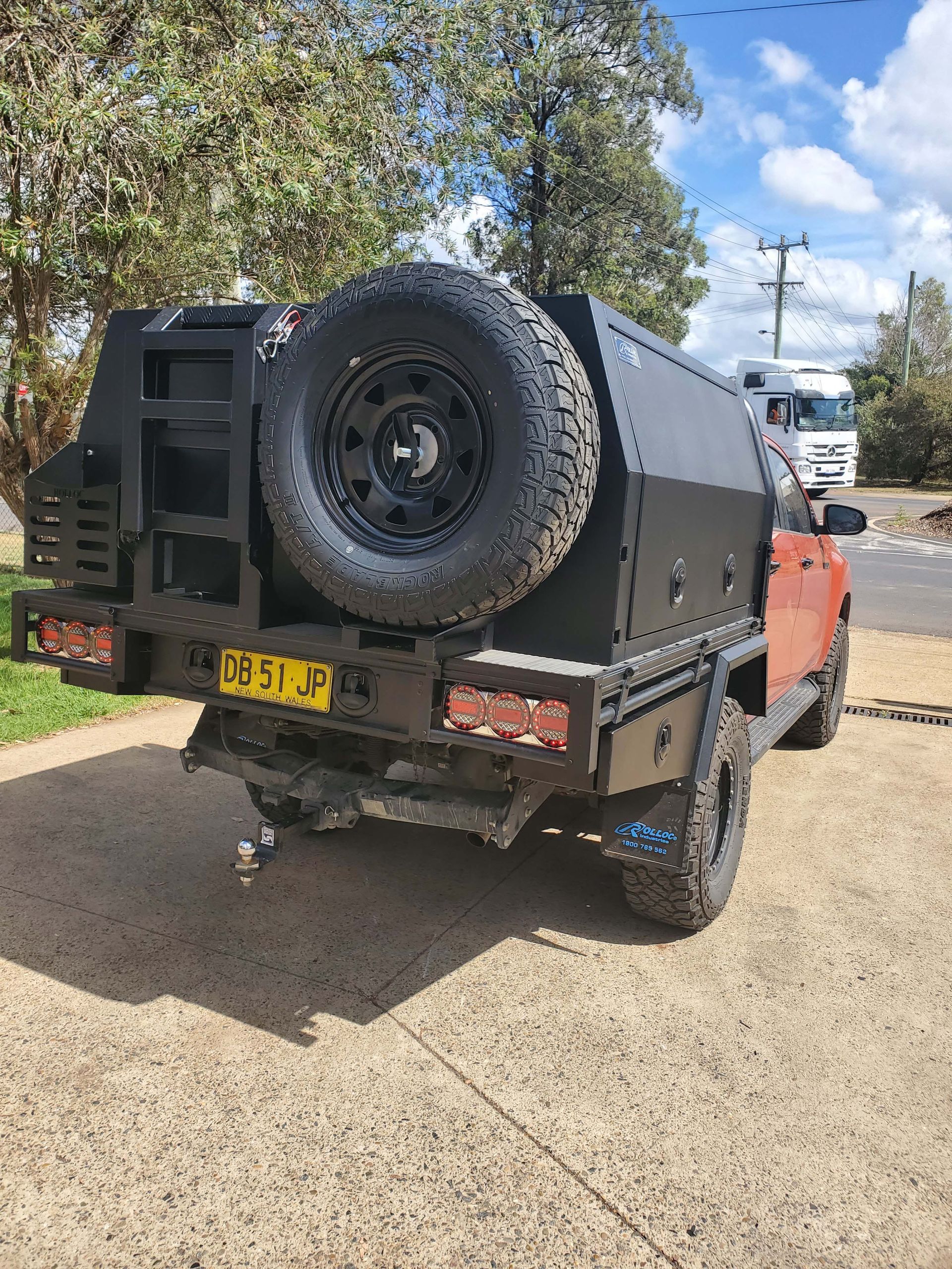 Red Truck with Canopy and Spare Tyre — Wilberforce, NSW — Rolloc Industries