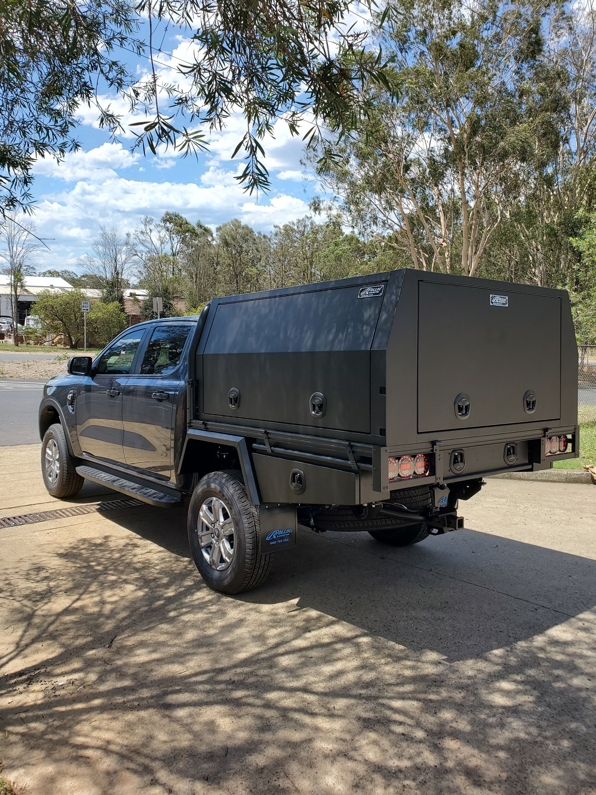 A Black Truck With A Canopy Is Parked On The Side Of The Road — Wilberforce, NSW — Rolloc Industries