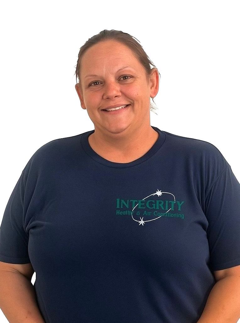 A woman wearing a blue shirt that says integrity on it
