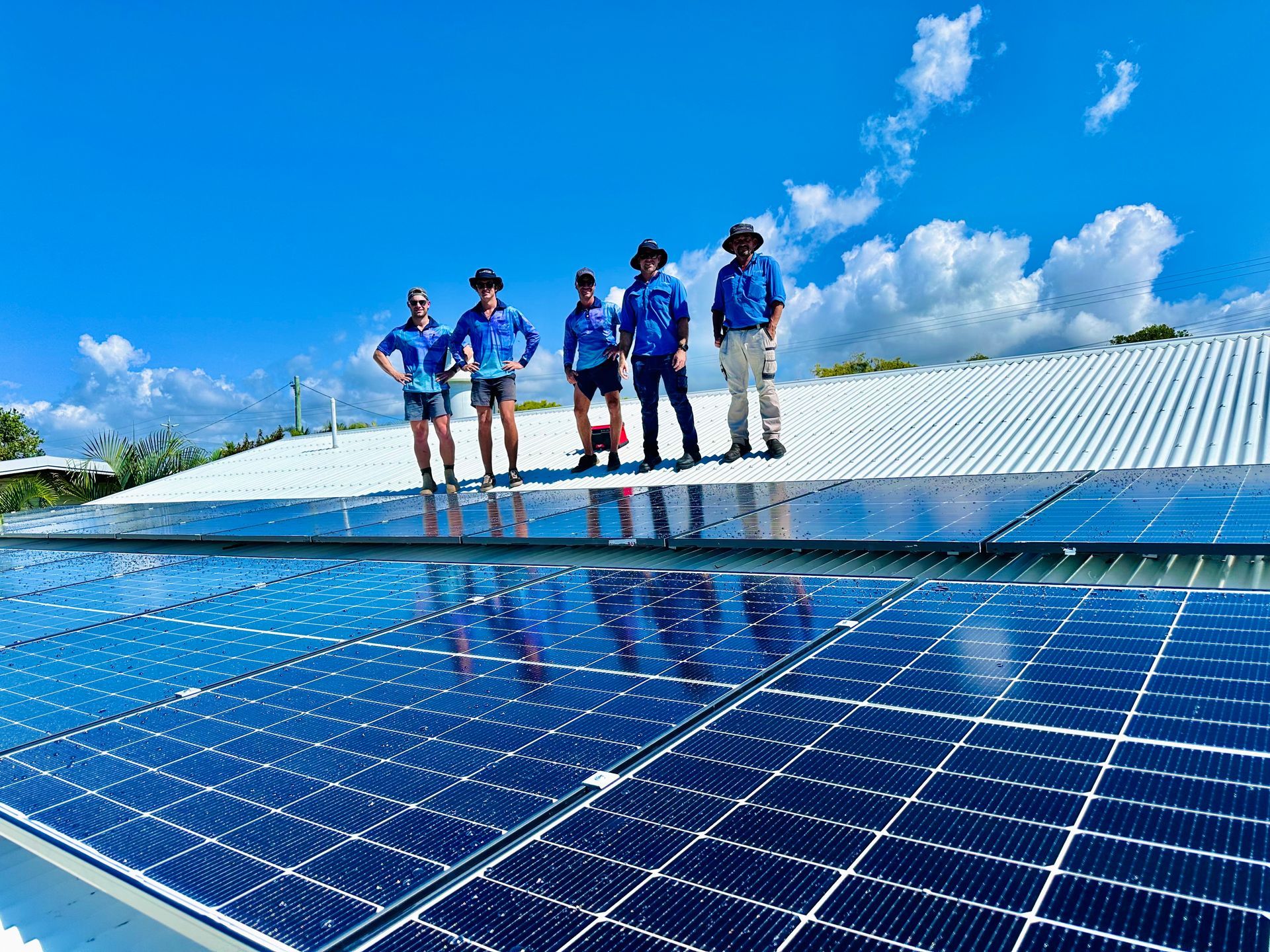 Men with Clean Solar Panels — Lahtinen Electrical And Refrigeration in Ingham, QLD