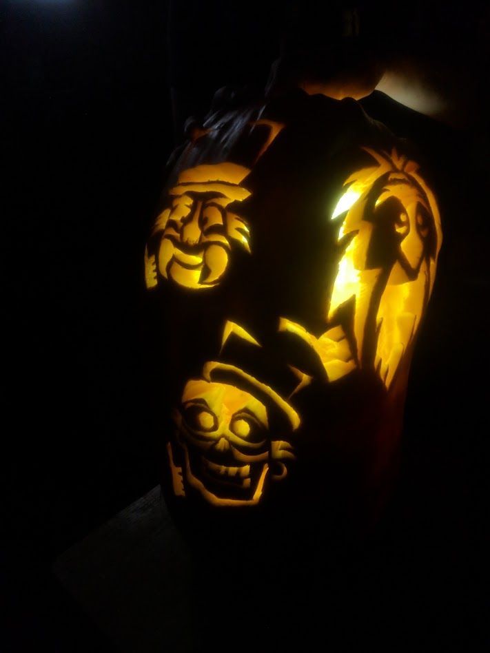 A pumpkin carved with the Three Hitchhiking Ghosts at Ostara's Grove, Vermont pumpkin patch