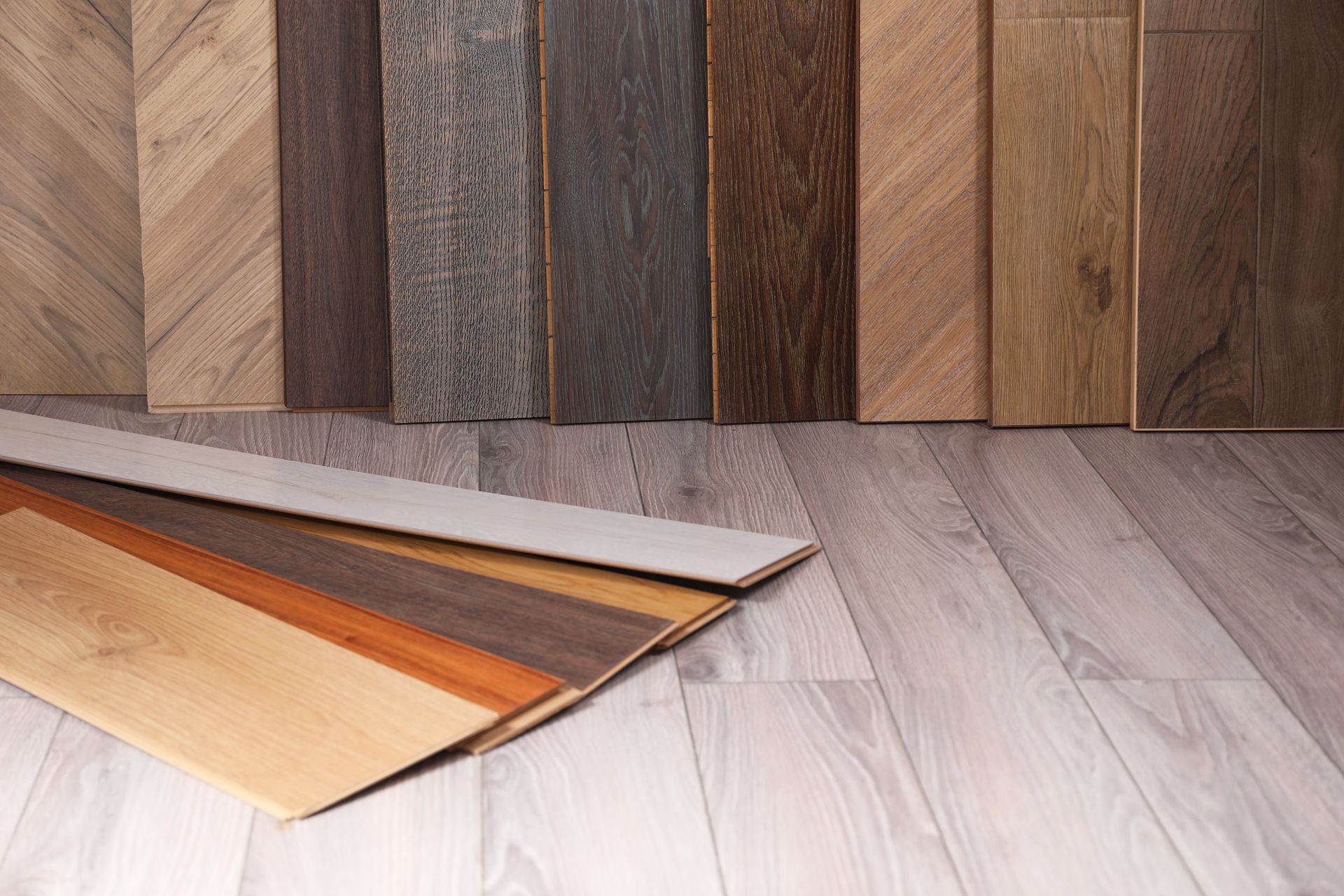 Variety of wood flooring samples in various colors and styles.